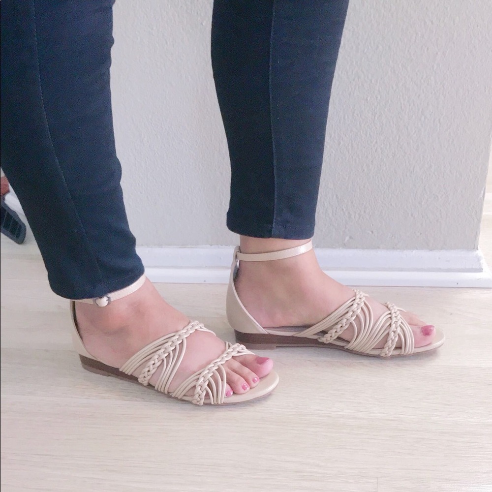 ladoes ankle buckle flat sandals. Nude